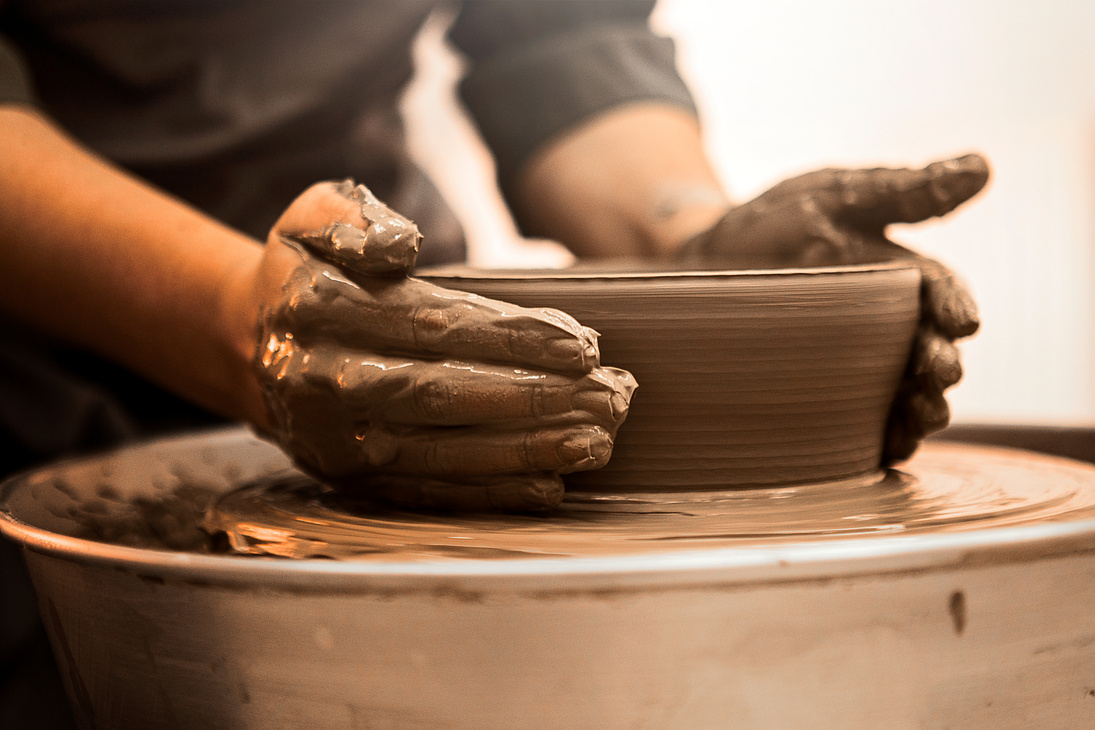 Pottery making by skilled hands on a pottery wheel