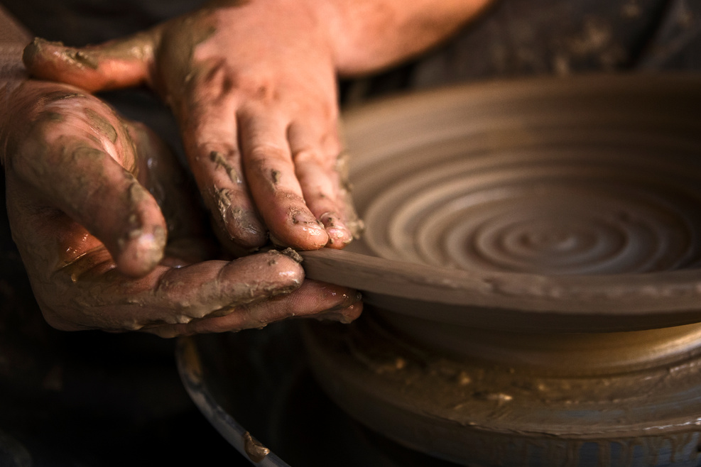 Pottery maker making pottery clay